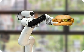brazo robotico sosteniendo una hamburguesa
